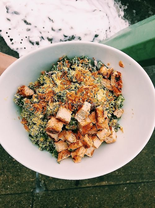Kale Buffalo Chikin Caesar Salad with house-made smoked coconut bits.  at Naked Cafe in Kelowna