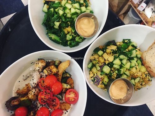 Buddah bowl--> quinoa, house-blended Cajun grilled tofu, mushroom & zucchini topped with fresh  cherry tomato & homemade tahini drizzle.
 2 x Curry Scrambles--> non-Gma tofu shredded like egg with hashbrowns, kale, broccoli and curry blend. Side homemade spicy mayo  at Naked Cafe in Kelowna