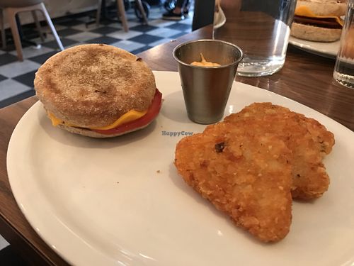 Breakfast sandwich and hash browns  at Naked Cafe in Kelowna