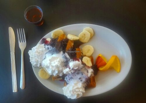 vegan waffles with bananas, blueberry sauce and coconut whipped cream! at Tia B's La Waffleria in Albuquerque