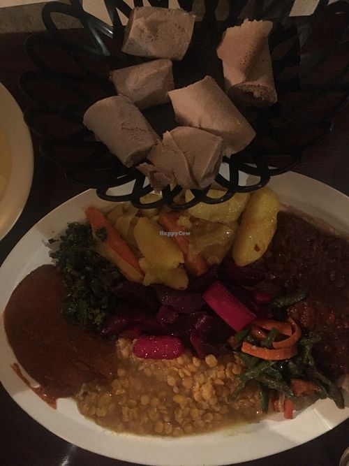2 person sampler. It is AWESOMELY delicious, but would be so much better with some fresh greens. It was also a bit small for two at that price/quality. at Hawi Ethiopian Restaurant in Ithaca