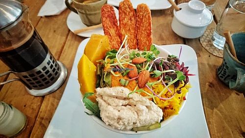 Tempeh bowl with cashew cheese, sweet squash, red hummus and other tastyness. at Backyard Cafe - Riverside in Phnom Penh