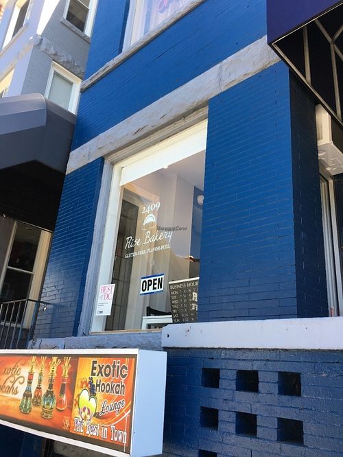 Window with hours at Rise Bakery in Washington
