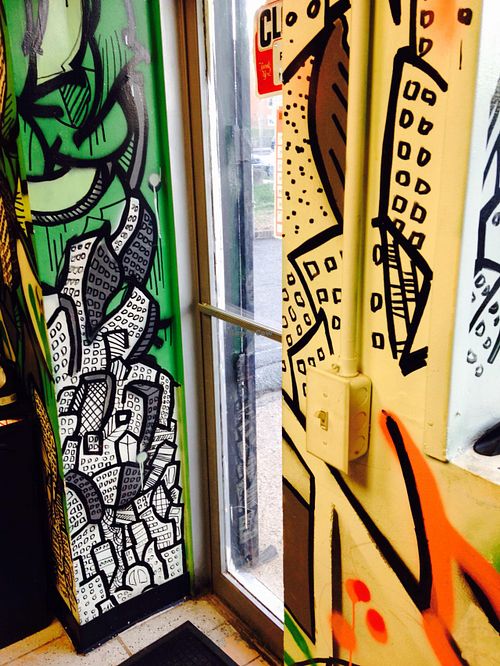 Doors adjacent artwork  at Far East Taco Grille in Washington