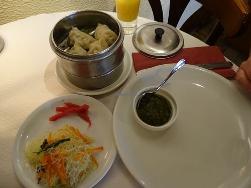Main dish of steamed dumplings with noodle salad and sauce at Pema Thang in Paris