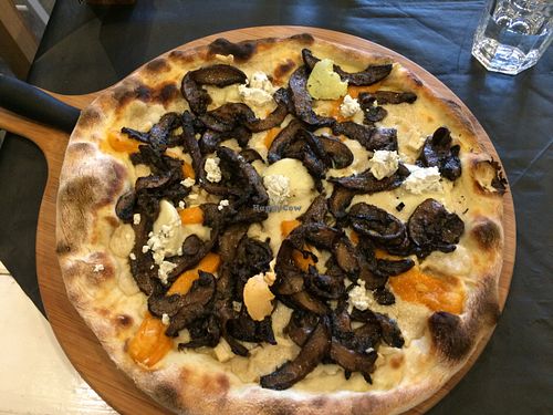 cheesy pizza with different kinds of vegan cheese and extra mushrooms at FED by Water in East London