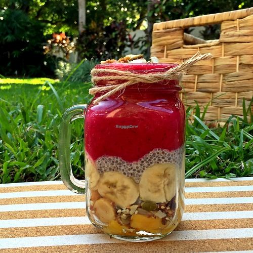 Pitaya Paradise (antioxidant-rich pitaya tropical blend + coconut and zesty orange organic chia seed pudding + banana + crunchy Paleo Hero gluten free granola) at Jooce Bar in Palm Cove