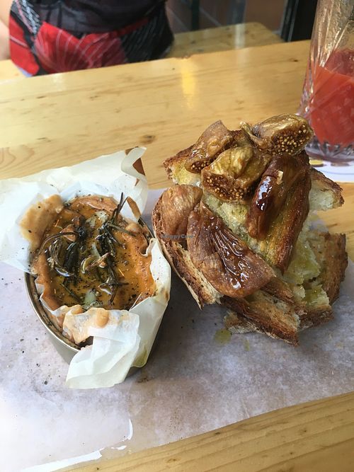 Oven backed cheese with garlic and rosemary &toasted bread, dried figs  at Alaska Bar in Berlin