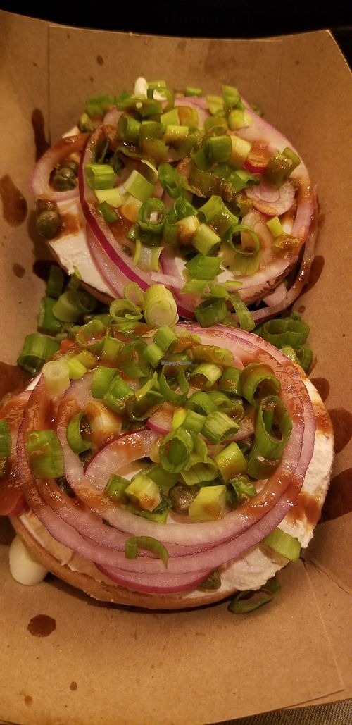 Multi national bagel with vegan cream cheese, onions, capers, and house made hot sauce at Los Bagels in Eureka