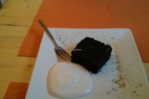Charcoal cake and vegan whipped cream. at Equilibrio in La Spezia