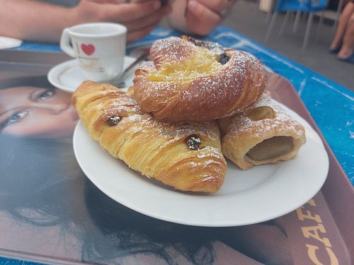Pastries with pistachio cream, custard and cherry jam, and cream cheese filling and raisins at Fratelli Piermattei in Rome