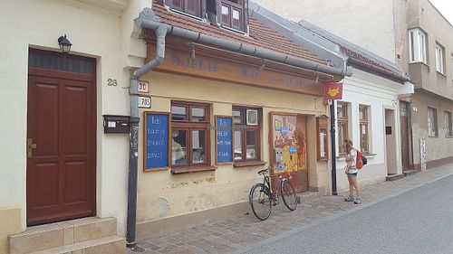 A hungry vegan looking disappointedly at a closed cafe that should have opened two hours previously. at Club Madrid in Kosice