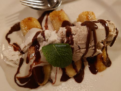 Banana with vanilla ice cream, chocolate sauce and vegan chantilly at Olive in Innsbruck
