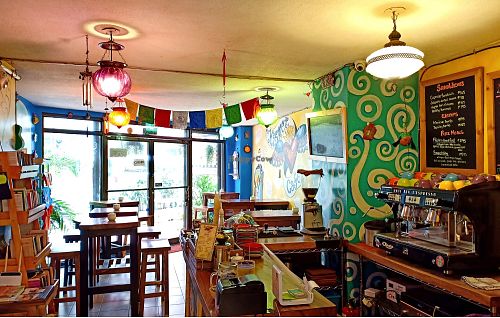Brightly colored murals and artifacts light up the cozy space. at The Kismet Cafe in Makati