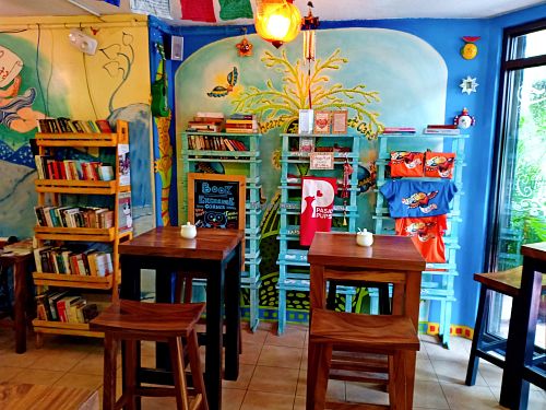 The book exchange shelf offers interesting reads and good trades. at The Kismet Cafe in Makati