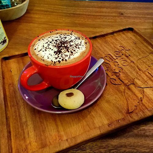 Hot cappuccino and a cool cookie! at The Kismet Cafe in Makati