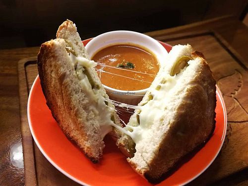 Jalapeño Grilled Cheese:  We serve our sandwiches with a side of tomato soup! at The Kismet Cafe in Makati