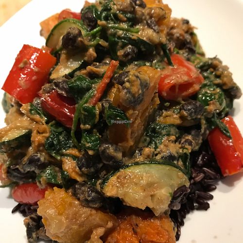 Vegan roasted veggies with black beans and spinach in spicy sauce on a bed of black rice   at The Health Workshop in Ashby De La Zouch