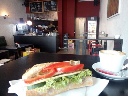 vegan baguette with tofu, vegan cheese, bell pepper, lettuce and vegan butter and soy cappuccino at mini bar in Heidelberg