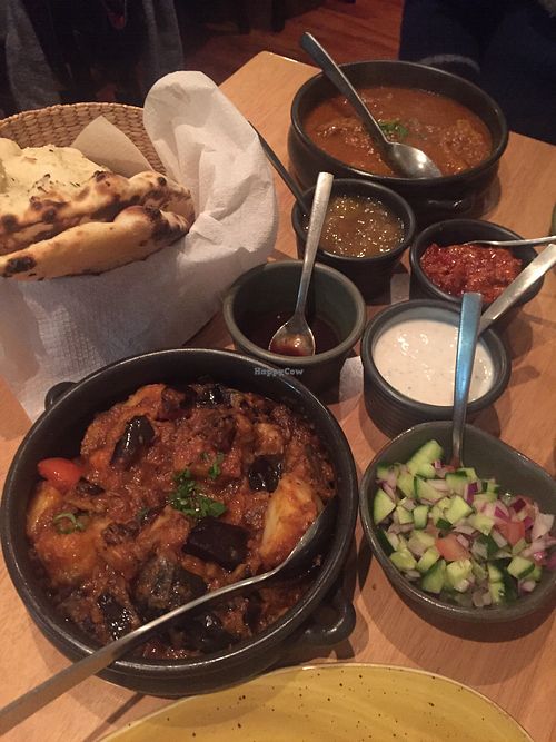 Garlic naan, eggplant potato curry, ";lamb"; rogan josh, and sides  at Green Mushroom in Newtown