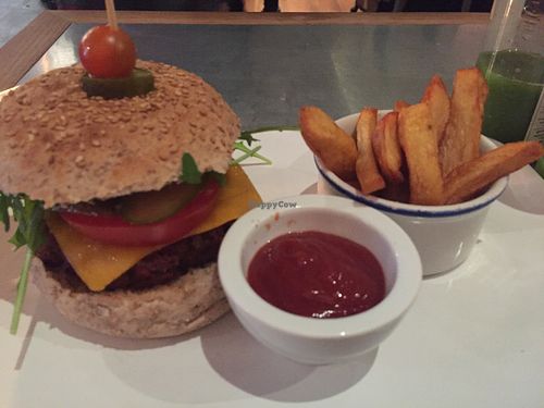 Seitan veggy burguer with potato wedges... Yummy at Teresa Carles Cocina Vegetariana in Barcelona