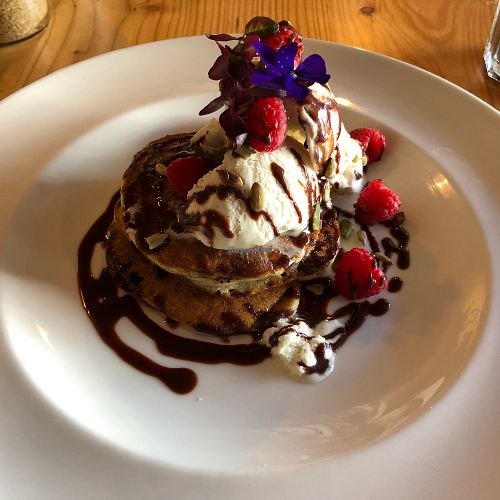 Pancakes with raspberries, chocolate sauce and ice cream at Anna Loka in Cardiff