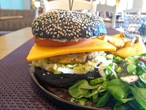 This burger at Bhajan was impressive: my first charcoal burger, a savoury patty and a great side salad. at Bhajan Cafe in Riga