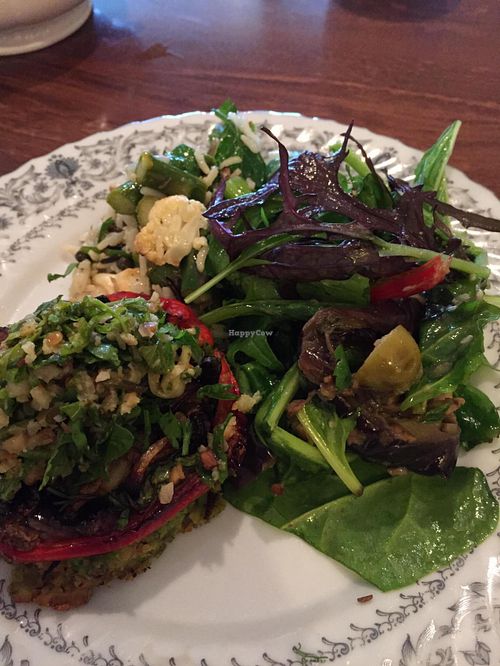Vegan tart with option of side salads. Tart has polenta (cornmeal crust) base and grains and veg on top with lovely light sauce. Salads were greens, grilled eggplant and rice pilaf. at Skye Pie Cafe in Isle Of Skye