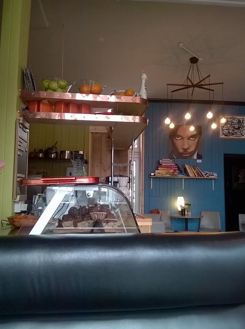 Inside décor and cake counter at Pulp Fiction Future Food and Juice Cafe in Whitley Bay