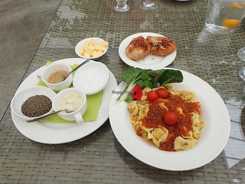 Fresh tomato based tortellini pasta, fresh bread, seasonings. Not shown, cucumber salad.  at Fridheimar in Reykholt