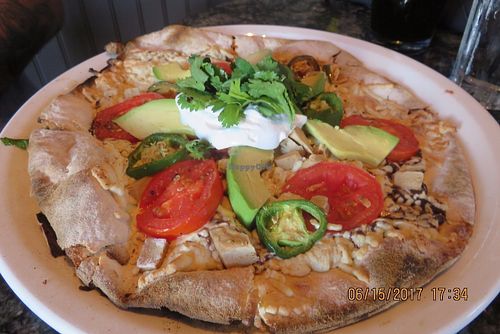 pizza with avocado and vegan chicken at Louisiana Pizza Kitchen in New Orleans