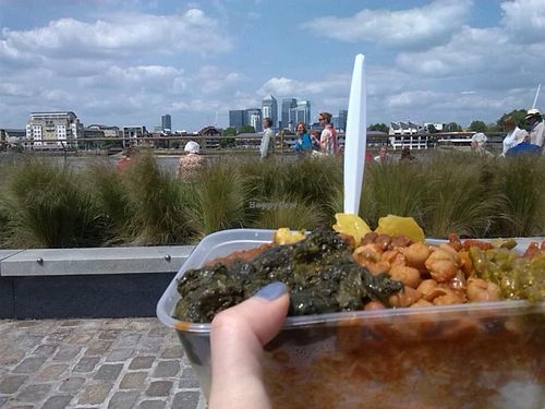 Mixed box with rice by the River Thames. Comforting and tasty. Spiced up with Red and Green Chilli sauces. at Red Tent Ethiopia in South East London