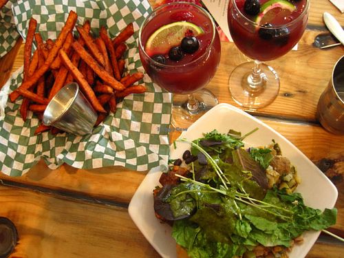 Sweet potatoe fries, sangria and an assortment of salads. at Panthere Verte - St. Denis in Montreal