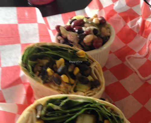 black bean & corn wrap with three bean salad side. at New Albanian Brewing Company Cafe and Brewhouse in New Albany