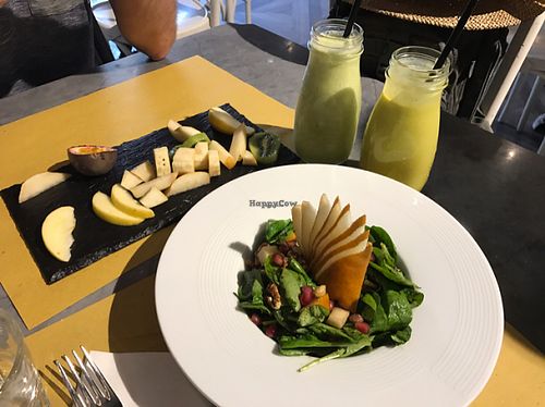 partially eaten fruit plate , smoothies and antioxidant salad at Buddy VEGGY in Rome