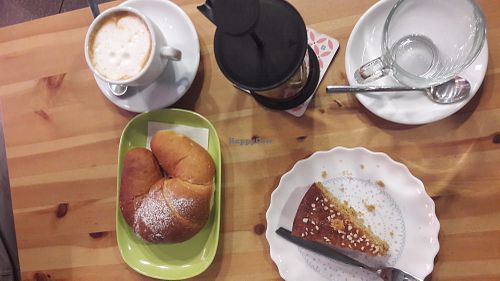 Breakfast with carrot cake and croissant at La Margherita in Bologna