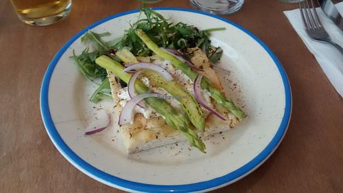 Focaccia, onion cream, aspargus and basil at Dune in Paris