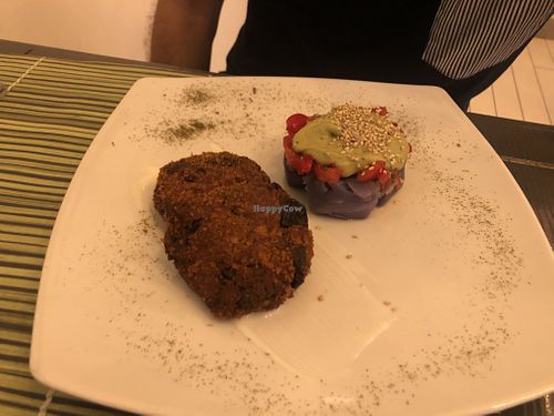 Aubergine balls, with a side of purple potatoes, avocado cream and tomatoes  at Cavoli Nostri in Naples