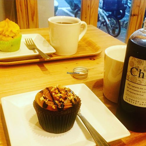 Yummy peanut and pineapple cupcakes with cold and hot coffee. at Green Bakery in Taipei