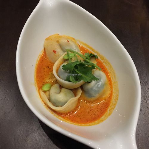 sweet pea ravioli in curry jus w. leeks and assorted mushrooms at Herban Fix Vegan Kitchen in Atlanta