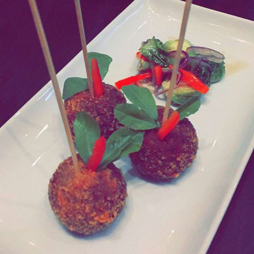 crispy purple yam cake at Herban Fix Vegan Kitchen in Atlanta