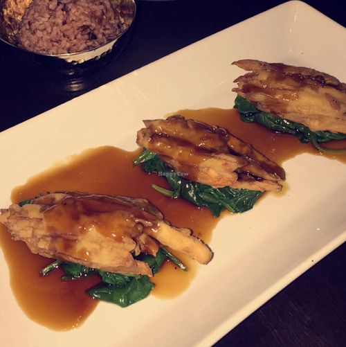 crispy king oyster mushroom glazed with sesame soy au jus at Herban Fix Vegan Kitchen in Atlanta