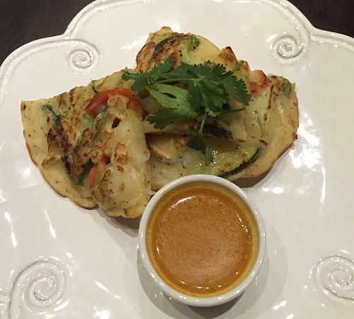 Pan seared scallion pancakes w. curry dressing  at Herban Fix Vegan Kitchen in Atlanta