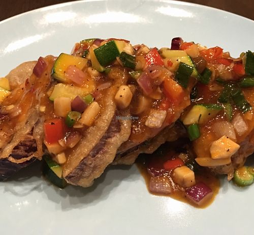 grilled eggplant topped w basil & minced garlic  at Herban Fix Vegan Kitchen in Atlanta