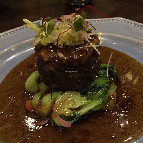 Seared Pom Pom Mushroom Steak with assorted vegetables.  at Herban Fix Vegan Kitchen in Atlanta