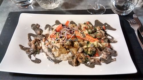 Seasonal vegetable Makloubeh and shiro-miso coco Acquerello risotto, mushrooms, black sesame sauce and sprouted seeds at La Table des Roy in Nantes