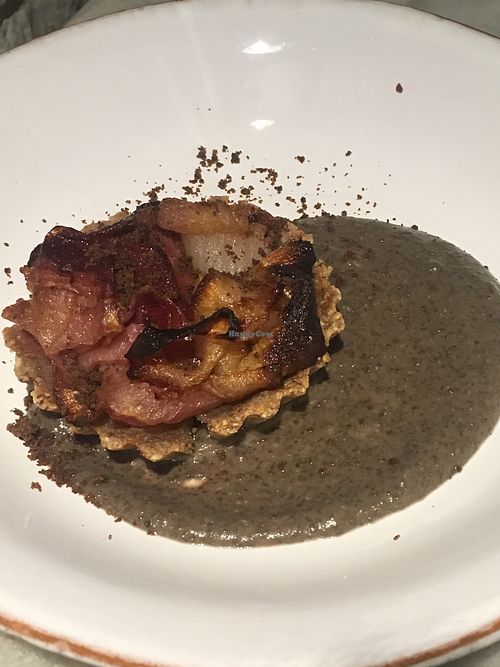 Buckwheat tart with caramelised onions and plums, lentil cream at Botanica Lab in Bologna