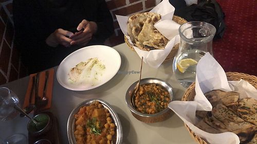 Alu chana masala, dal jhaneko, plain naan, tandoori laccha paratha. All vegan except naan. at Maharaja in Ljubljana
