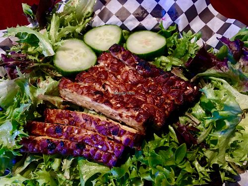 Baked tempeh on greens at Black Water Bar in Portland