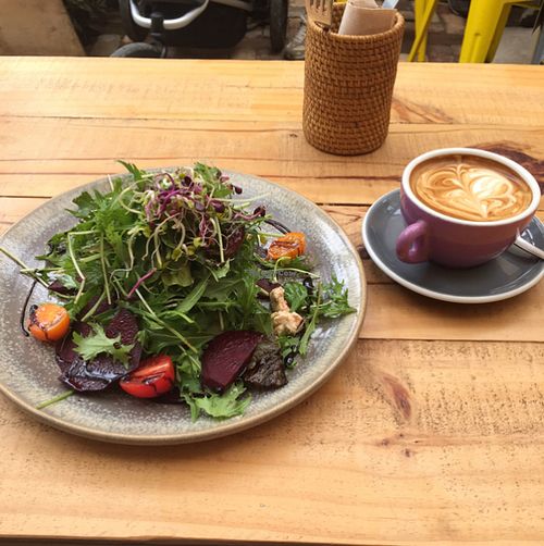 warm salad and almond flat white  at Cafe Mimosa in Takapuna